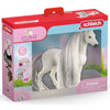 Schleich Quarter Horse ló puha sörénnyel és kiegészítőkkel
