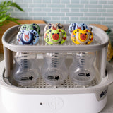 Suzete ortodontice Tommee Tippee Fun Friends, 6-18 luni, cutie de sterilizare cu ursuleț de pluș/veveriță albastră +